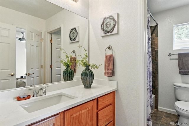 full bathroom featuring tile patterned flooring, toilet, a shower with curtain, a textured wall, and vanity