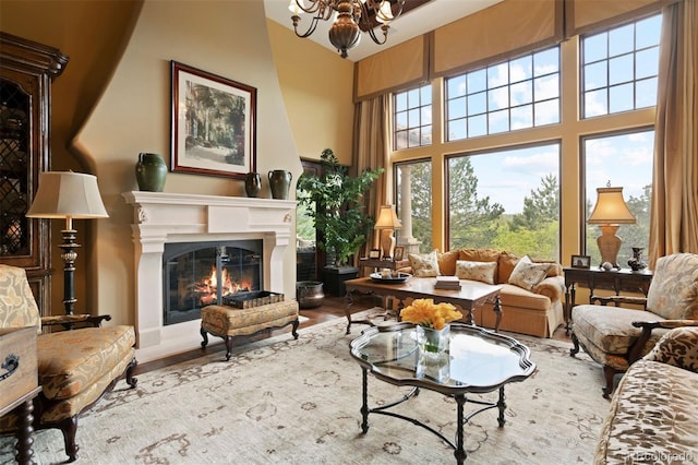 living room featuring light wood-type flooring and a chandelier