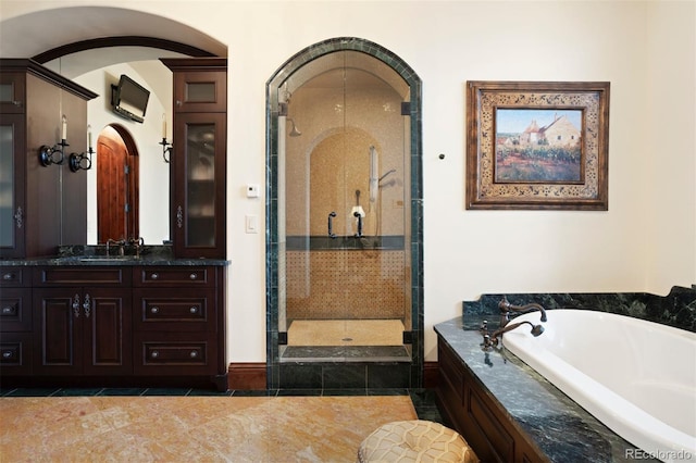 bathroom with separate shower and tub, tile patterned floors, and vanity