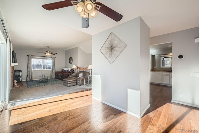 interior space with lofted ceiling, sink, and dark hardwood / wood-style floors