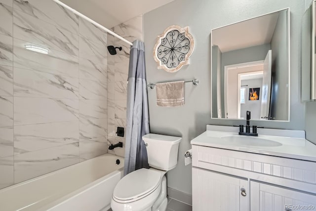 full bathroom with vanity, shower / tub combo, and toilet