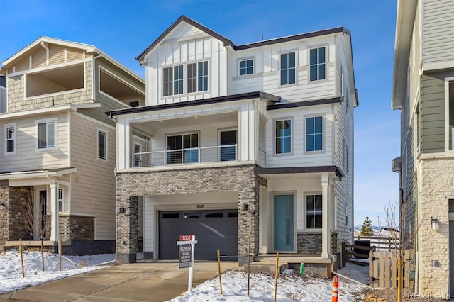 view of front of home with a garage and a balcony