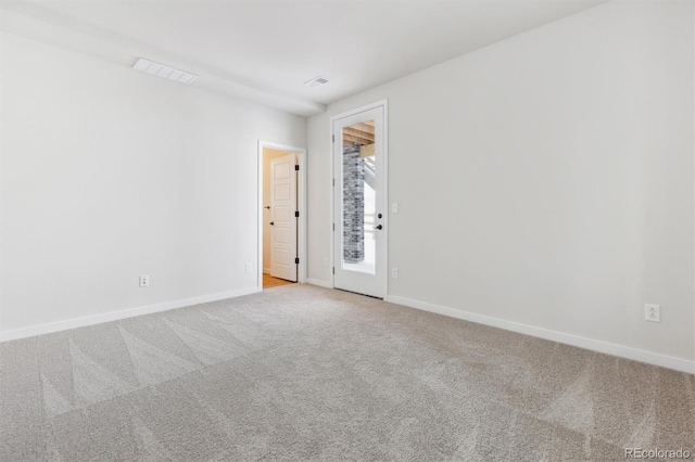 spare room with light carpet