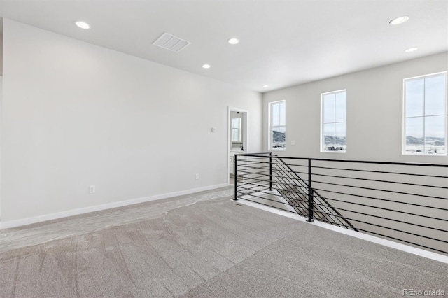 empty room featuring light carpet