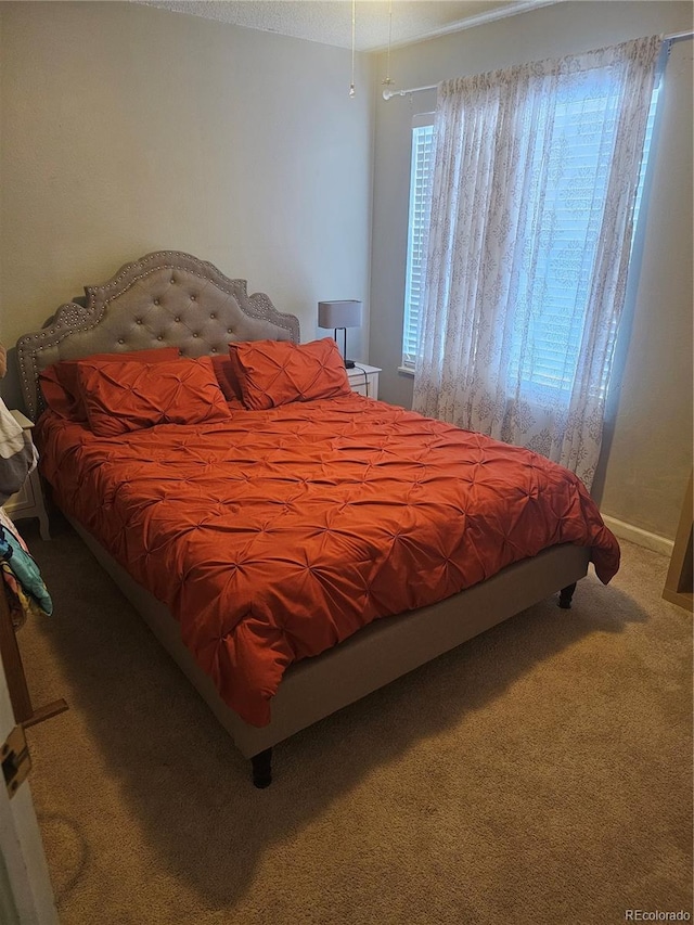 bedroom featuring carpet flooring