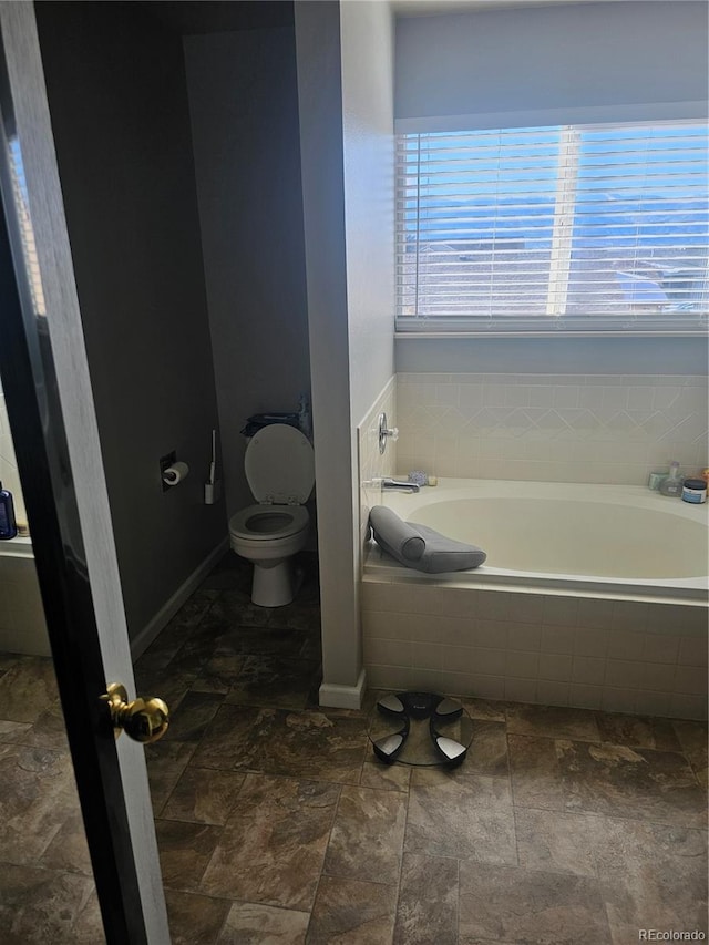 530 Jayton Dr, Colorado Springs, CO 80911 - bathroom with toilet and tiled bath
