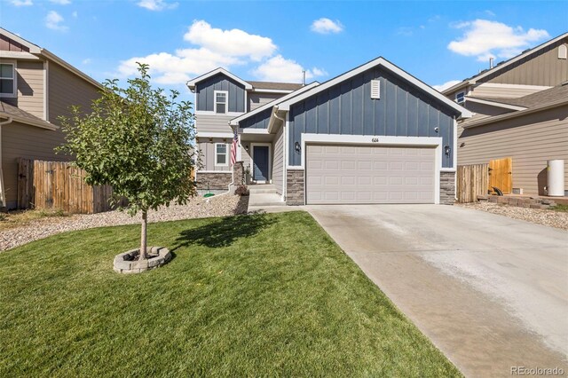 craftsman-style home with a front yard and a garage