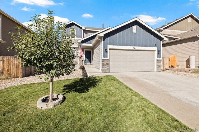 view of front of home featuring a front yard and a garage