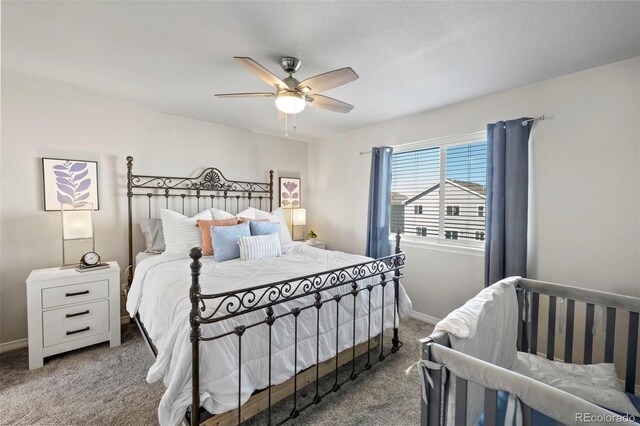 carpeted bedroom with ceiling fan