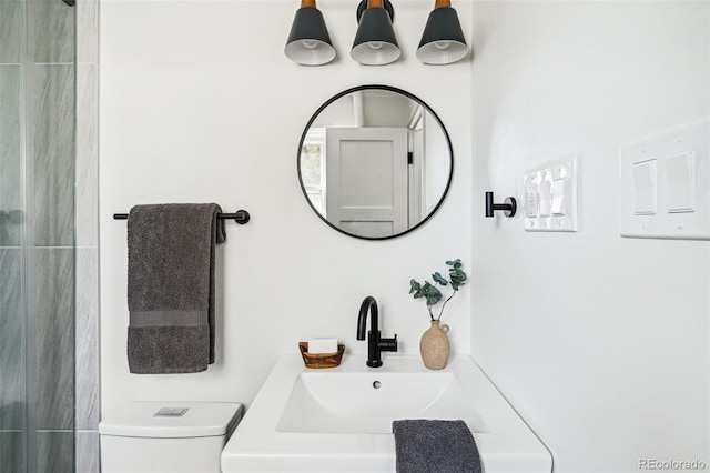 bathroom with toilet and sink