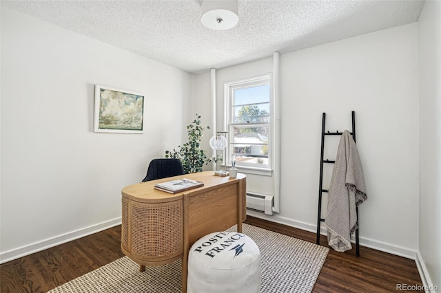 home office with a textured ceiling, dark hardwood / wood-style floors, and a baseboard heating unit