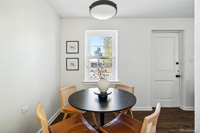 dining room featuring dark hardwood / wood-style flooring