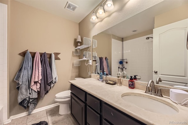 26072 E Fremont Pl, Aurora, CO 80016 - bathroom with tiled shower, vanity, and tile patterned floors