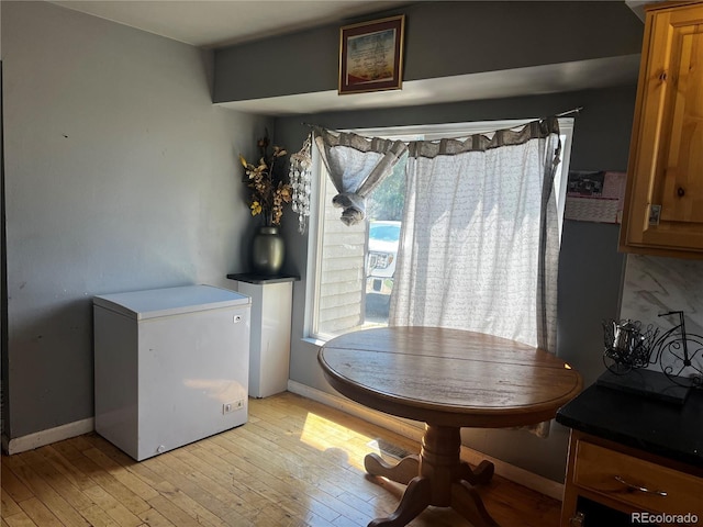 5129 Chandler Way, Denver, CO 80239 - dining space featuring light wood finished floors and baseboards