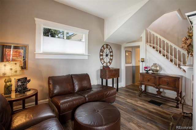 living room featuring dark wood-type flooring