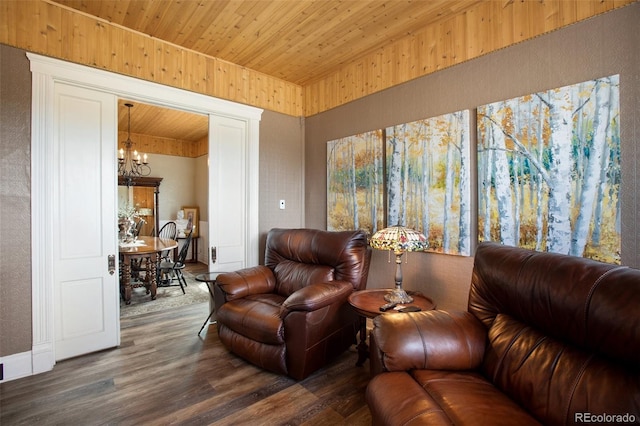 living room with an inviting chandelier, dark wood-type flooring, and wood ceiling