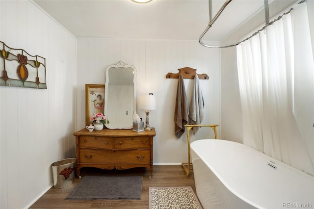 bathroom featuring a bathing tub and wood-type flooring