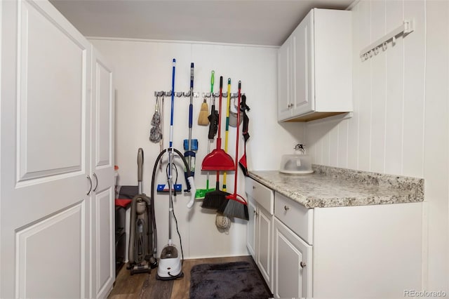 kitchen featuring dark hardwood / wood-style floors and white cabinetry