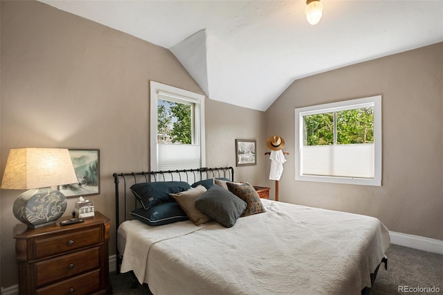 bedroom with carpet and vaulted ceiling