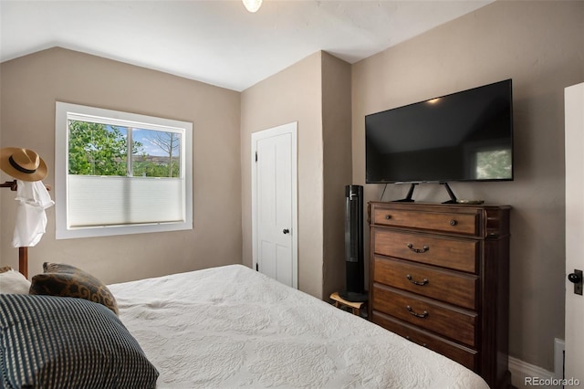 bedroom with vaulted ceiling