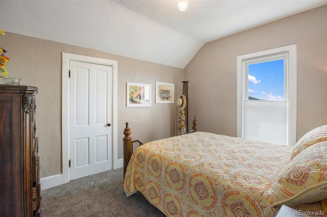 carpeted bedroom featuring vaulted ceiling