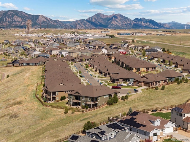 aerial view of residential area featuring mountains