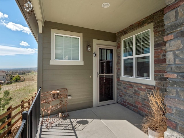 property entrance with stone siding