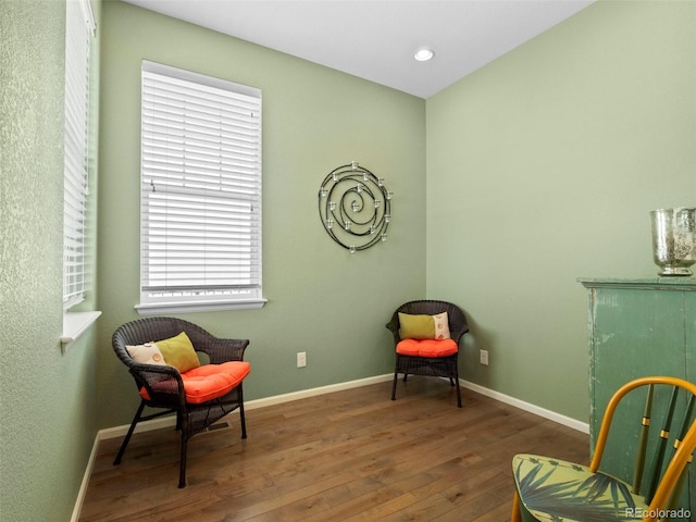 sitting room featuring wood finished floors, baseboards, and recessed lighting
