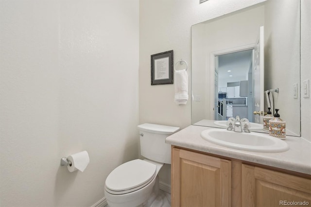 half bath with toilet and vanity