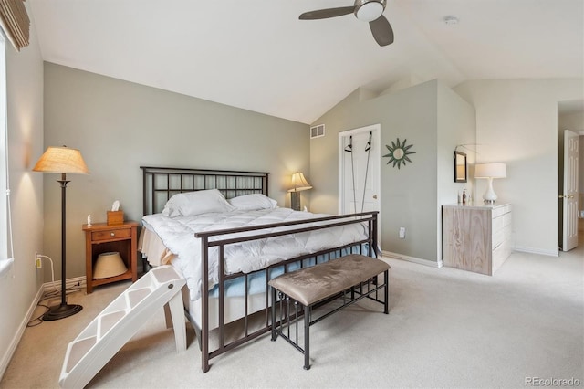 bedroom featuring vaulted ceiling, baseboards, light colored carpet, and visible vents