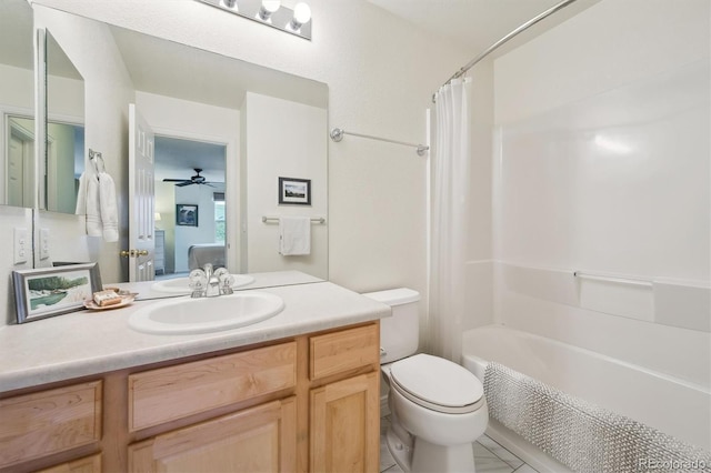 ensuite bathroom with vanity, tile patterned flooring, shower / bath combo with shower curtain, toilet, and connected bathroom