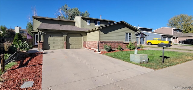 view of front of house with a front lawn and a garage