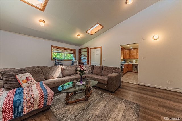 living room featuring wood-type flooring, a skylight, and high vaulted ceiling