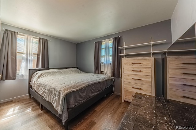 bedroom featuring hardwood / wood-style floors