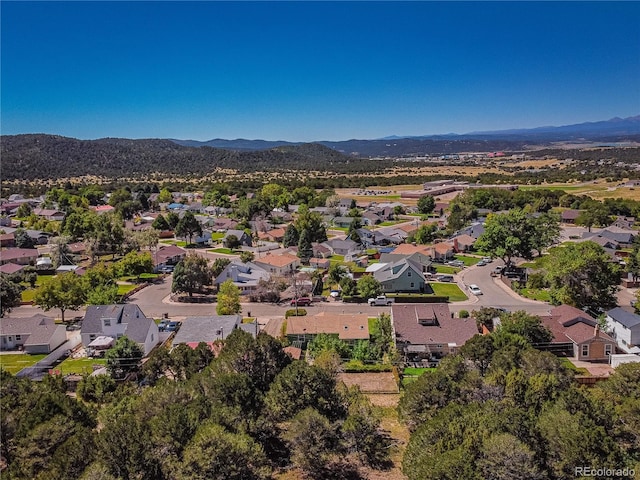 drone / aerial view featuring a mountain view