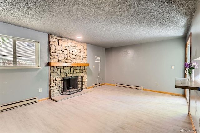 unfurnished living room with a baseboard heating unit, wood finished floors, a textured ceiling, and a stone fireplace