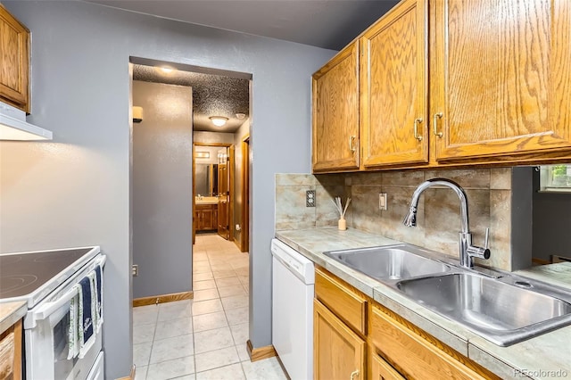 kitchen with white appliances, a sink, light tile patterned floors, backsplash, and extractor fan