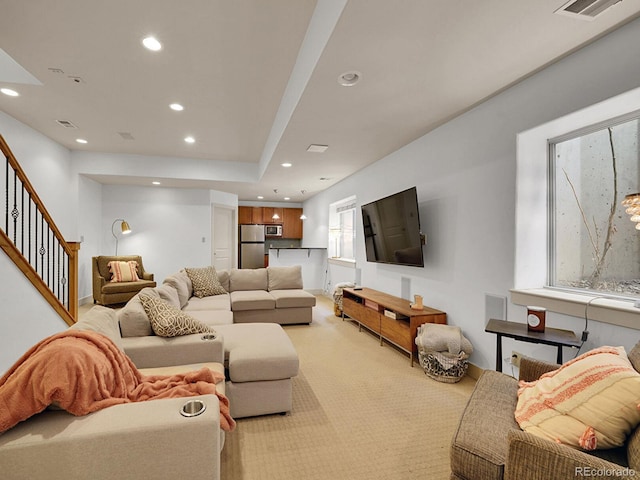 living area with light colored carpet, stairs, recessed lighting, baseboards, and visible vents