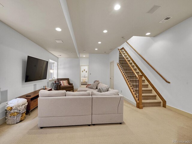 living area featuring visible vents, baseboards, stairway, recessed lighting, and carpet