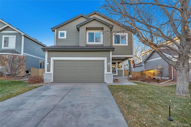 view of front of property featuring a garage and a front lawn