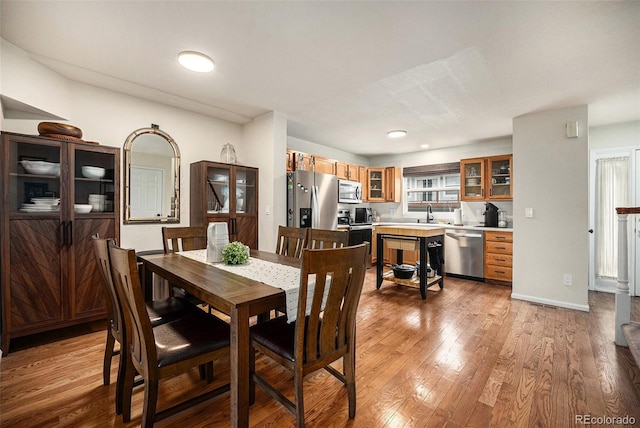 dining area with wood finished floors