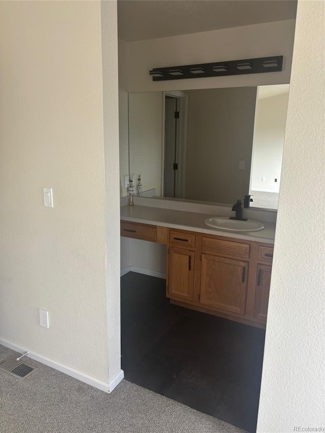 6240 Everett Ct Unit D, Arvada, CO 80004 - bathroom with vanity and baseboards