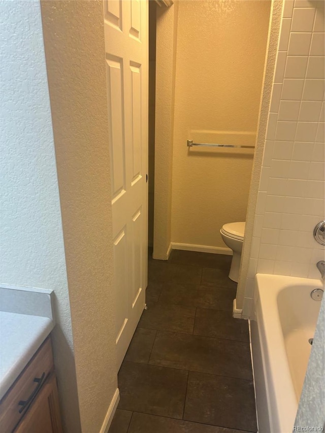 6240 Everett Ct Unit D, Arvada, CO 80004 - full bathroom with a textured wall and vanity