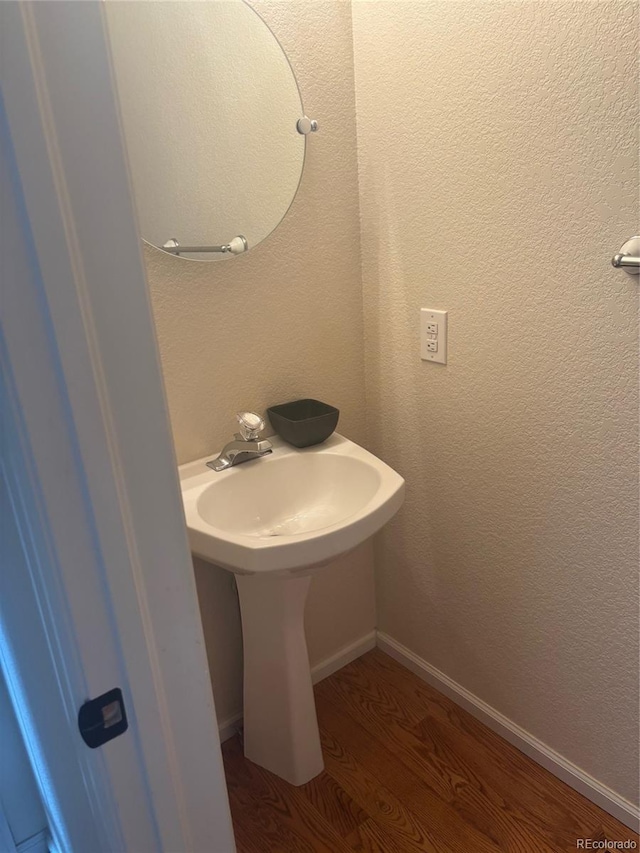 6240 Everett Ct Unit D, Arvada, CO 80004 - bathroom featuring wood finished floors and a sink