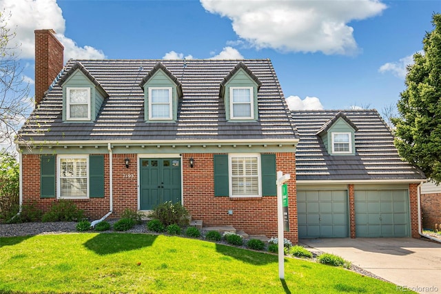 7193 S Newport Way, Centennial, CO 80112 - cape cod home featuring brick siding, a chimney, driveway, a front lawn, and an attached garage