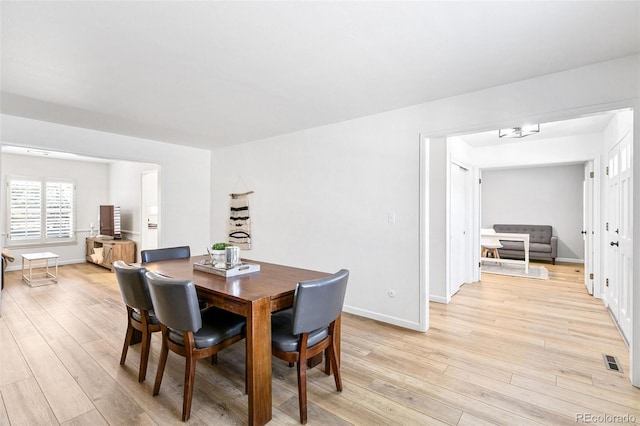 7193 S Newport Way, Centennial, CO 80112 - dining area with light wood-style flooring and baseboards