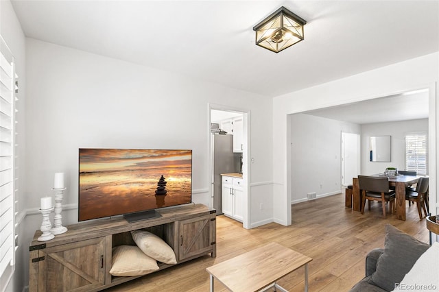 7193 S Newport Way, Centennial, CO 80112 - living area featuring light wood finished floors and baseboards