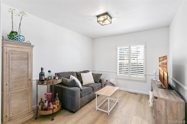 7193 S Newport Way, Centennial, CO 80112 - living area with light wood finished floors and baseboards