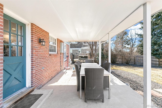 7193 S Newport Way, Centennial, CO 80112 - fenced backyard featuring outdoor dining area and a patio area