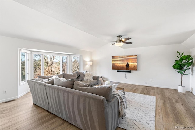 7193 S Newport Way, Centennial, CO 80112 - living room featuring lofted ceiling, ceiling fan, and light wood-style floors